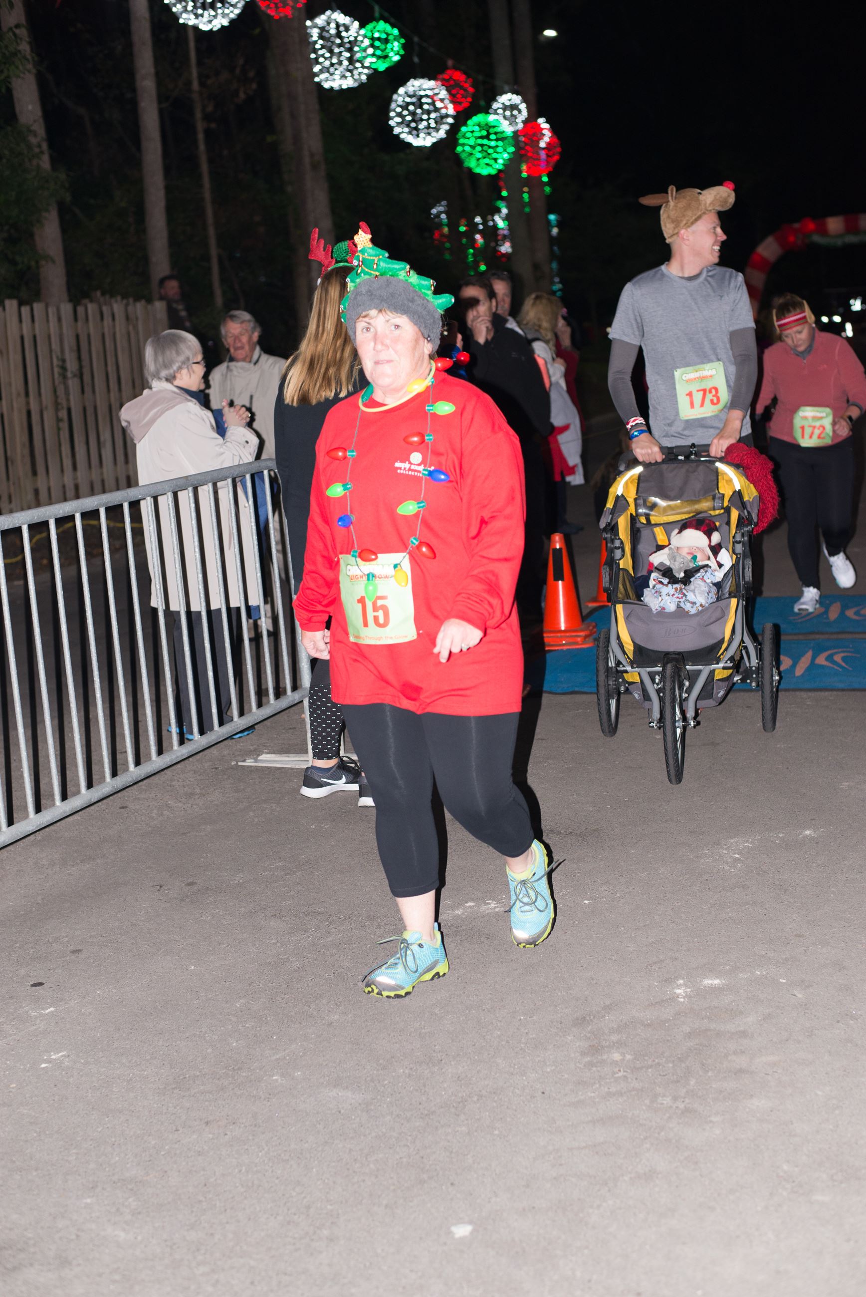 Running Participant Walking Down a Sidewalk