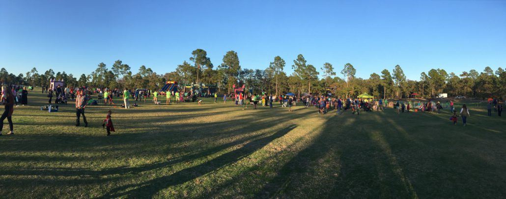 Panoramic view of Howl-O-Scream participants in the meadow at night